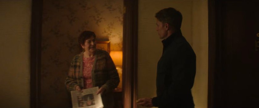 Dex talking to his neighbor Mrs Smithers in the hallway.