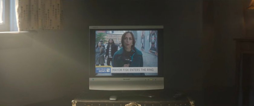 Television showing a news report on the boxing match at Fogwell's Gym.