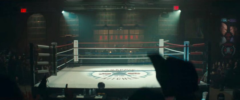 The boxing ring and crowd inside Fogwell's Gym.