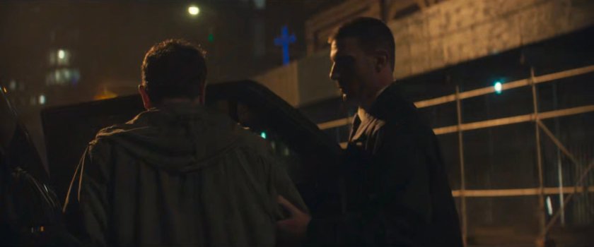 Christofi being escorted from the resistance hideout by two US Marshals.