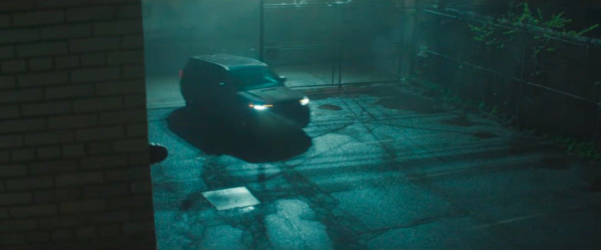 Car pulling up outside the US Marshal safe house.