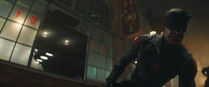 Daredevil on sidewalk outside Fogwell's Gym.