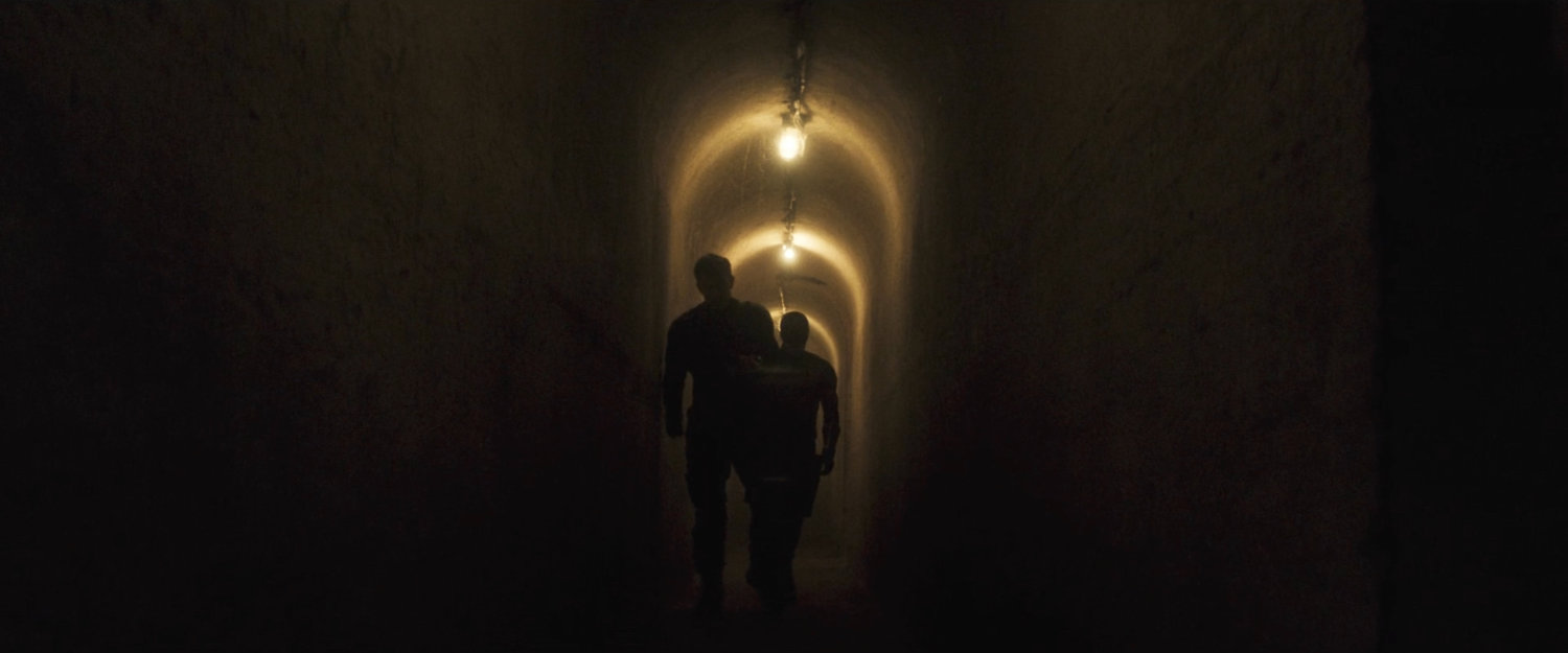 Daredevil and Bullseye in a tunnel under the restaurant.