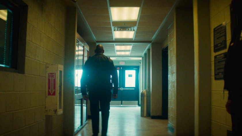 Flashback of a hallway in the 15th Precinct.