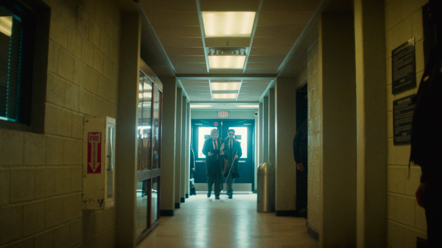Flashback of Matt and Foggy in a hallway in the 15th Precinct.