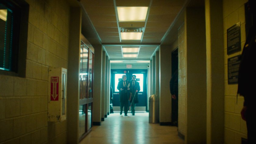 Flashback of Matt and Foggy in a hallway in the 15th Precinct.