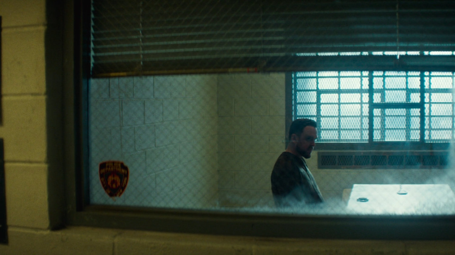 Flashback of Lionel in an interrogation room in the 15th Precinct.