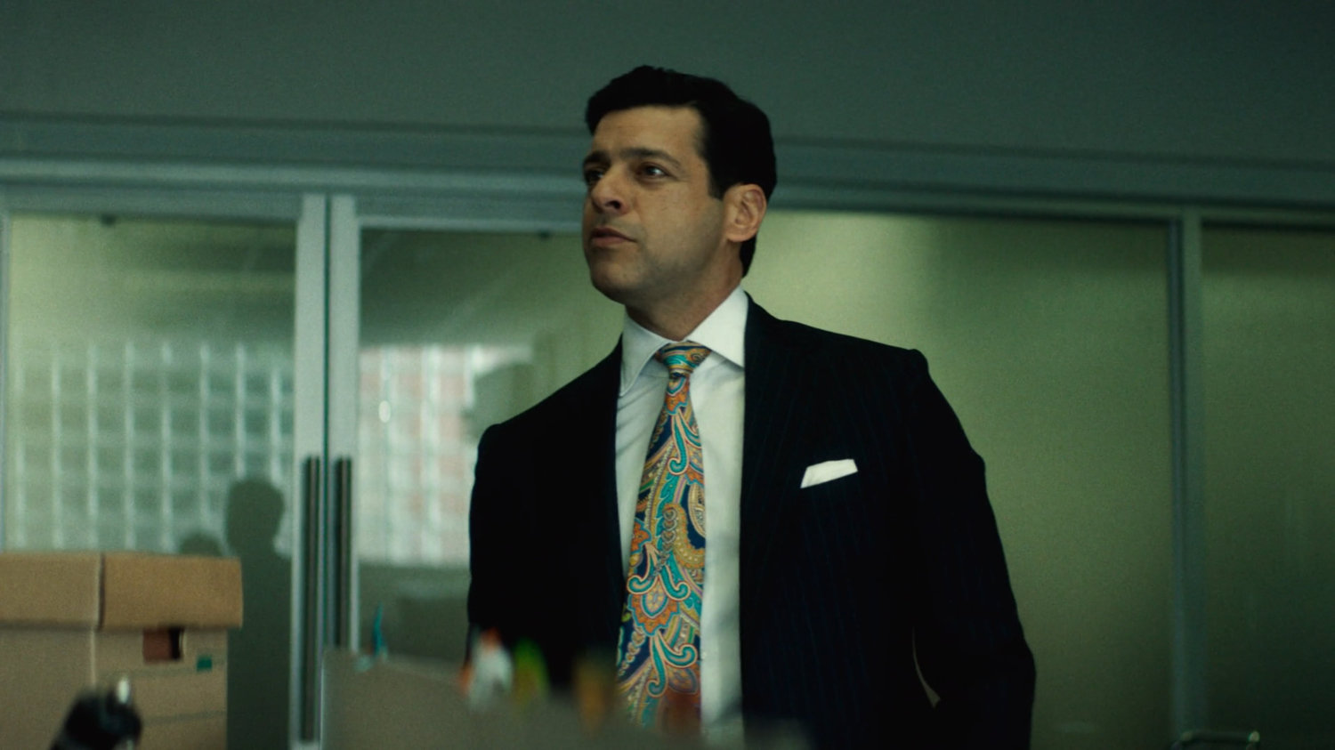 Flashback of Mr. Levine in the Landman Zack offices.