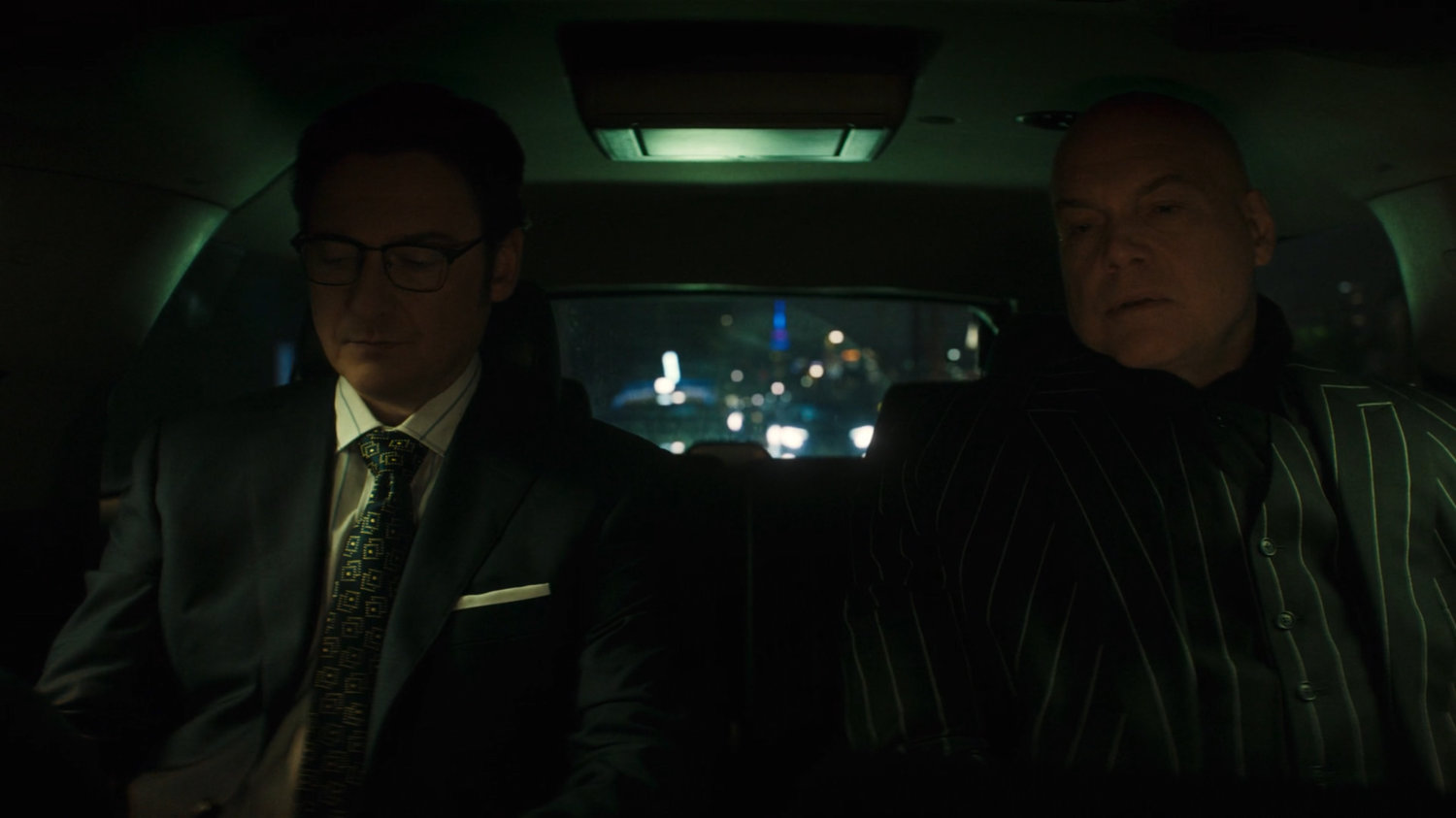 Flashback of Wesley and Fisk in the backseat of an SUV.