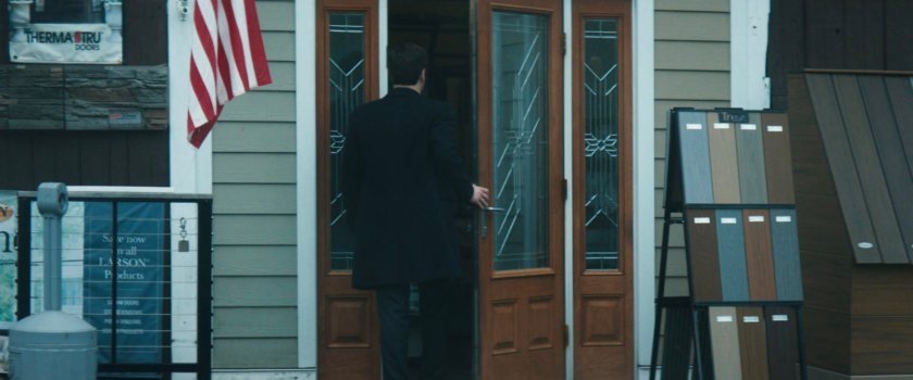 Buck entering a lumber store.