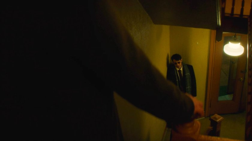 Flashback of Foggy descending stairs towards Matt in Lionel's apartment building.