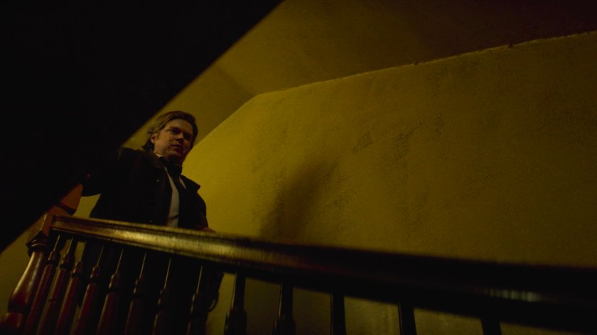 Flashback of Foggy descending stairs towards Matt in Lionel's apartment building.