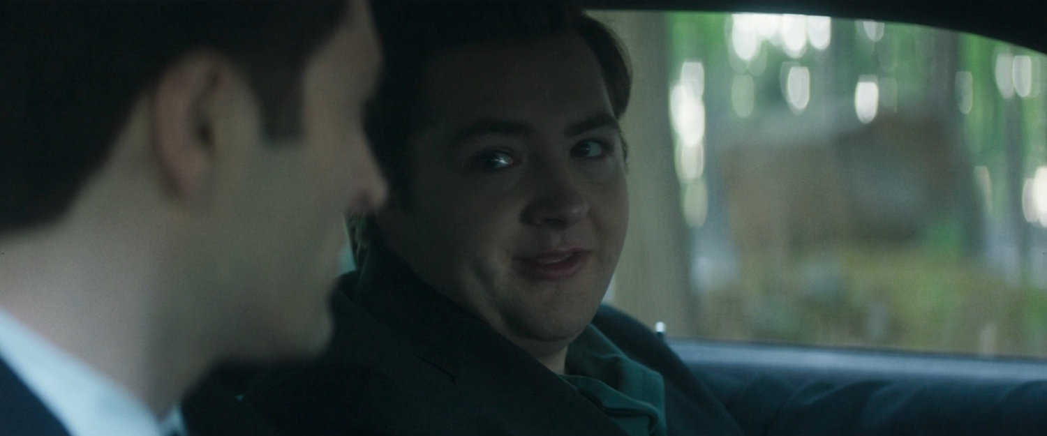 Daniel and Buck in a car in the woods.
