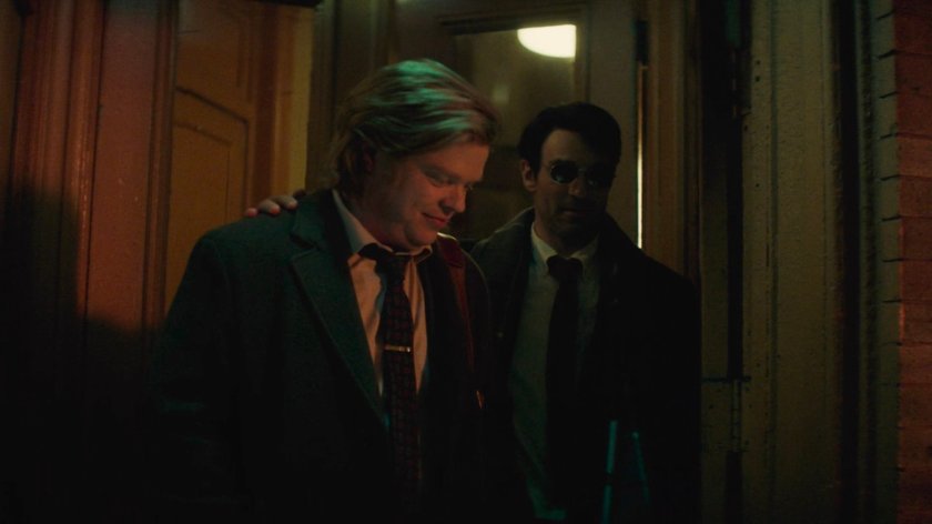 Flashback of Foggy and Matt on the sidewalk outside Lionel's apartment building.