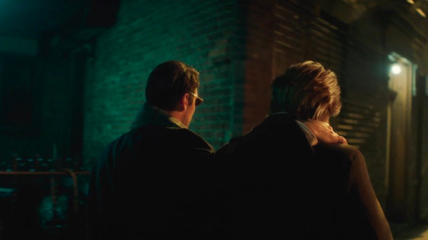 Flashback of Foggy and Matt on the sidewalk outside Lionel's apartment building.