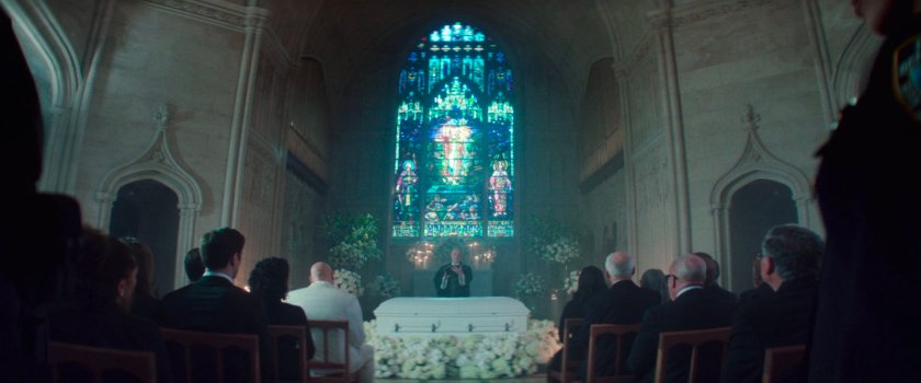 Fisk and mourners inside the cemetery chapel.