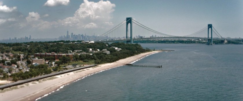 Aerial view of the Verrazzano-Narrows Bridge and the tip of Staten Island.