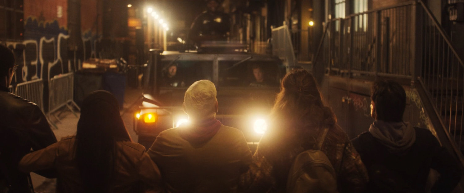 Interstitial: protesters block an AVTF SUV in a small street.