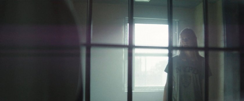 Karen in a holding cell at the 15th Precinct.