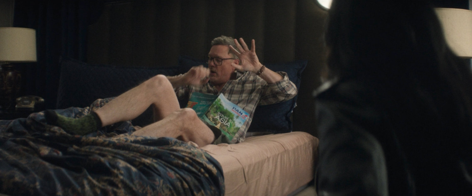 Mr. Charles's is confronted by Jessica Jones in his apartment.