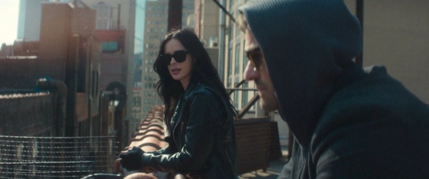 Matt and Jessica discuss next steps on a city rooftop.