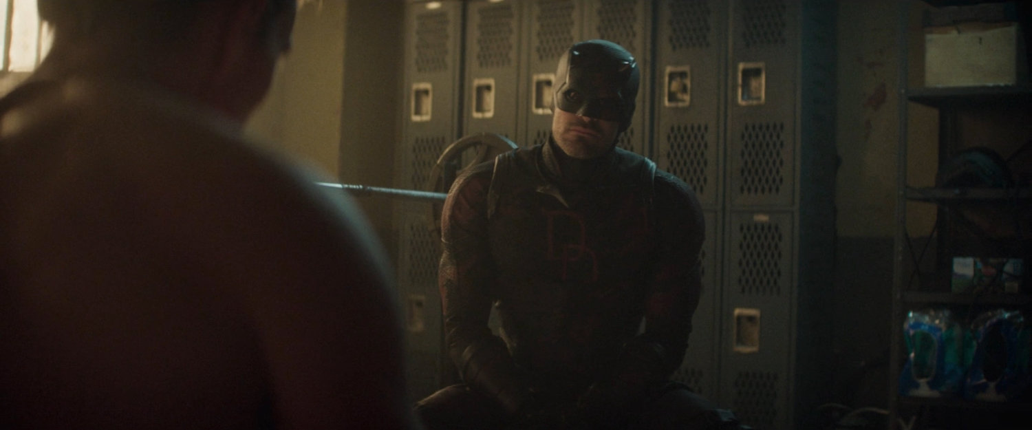Daredevil offers Bullseye a deal in Frank Castle's old hideout.