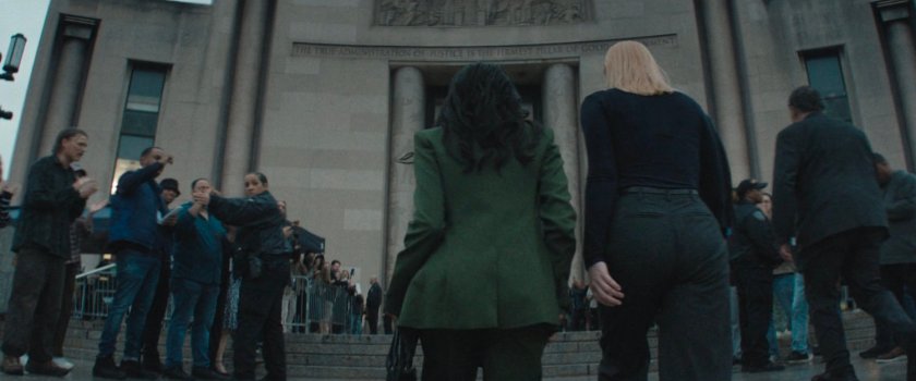 Kristen escorts Karen into a city courthouse.