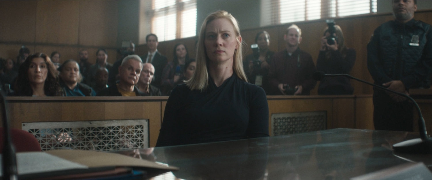 Karen in a crowded city courtroom.