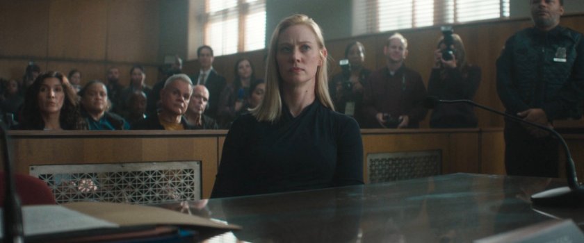 Karen in a crowded city courtroom.