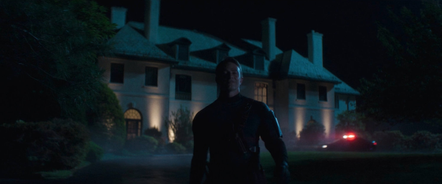 Bullseye walking away from the Governor's mansion at night.