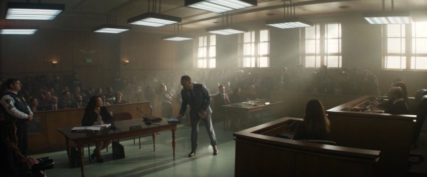Karen, Matt, and others in a crowded city courtroom.