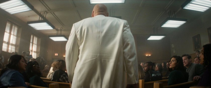 Mayor Fisk enters a crowded city courtroom.