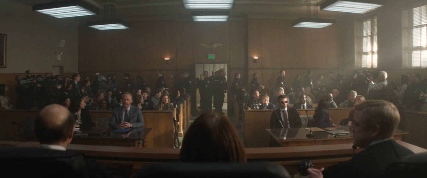 A crowded city courtroom.