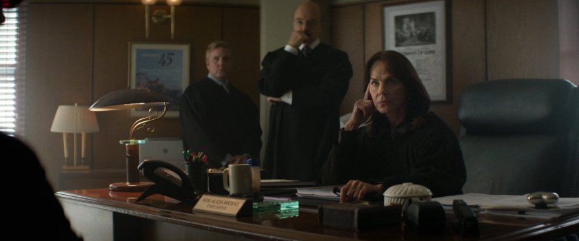 Three judges in a city courthouse office.