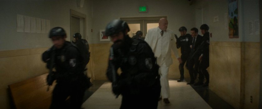 Mayor Fisk and AVTF officers in a hallway outside the city courtroom.