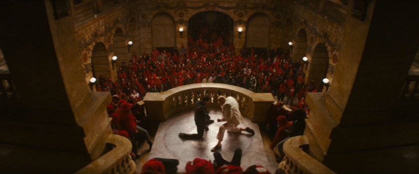Daredevil and Fisk amongst a crowd of citizens in the city courthouse lobby.