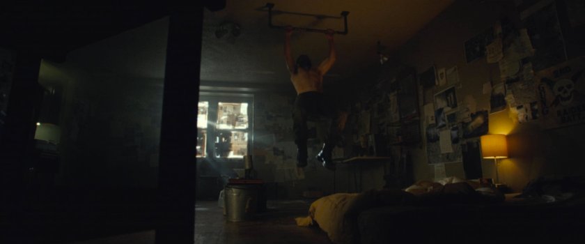 Frank doing pullups in his apartment.