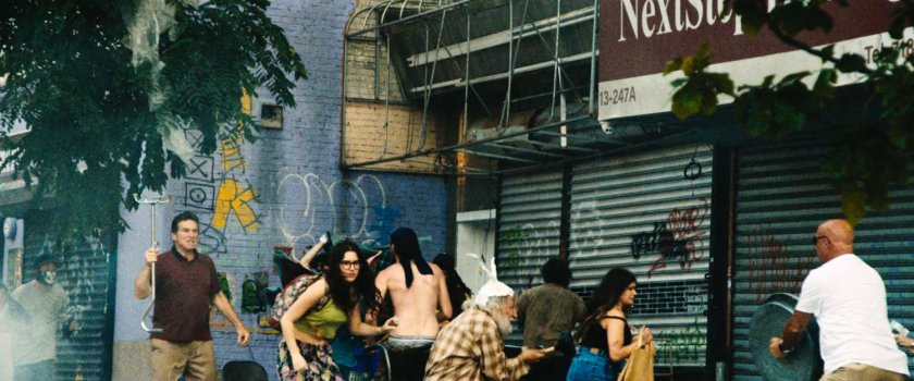 Rioters on a sidewalk in Little Sicily.