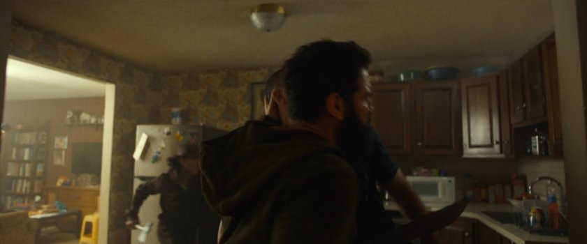 Frank fighting would-be killers in Isaiah's apartment.
