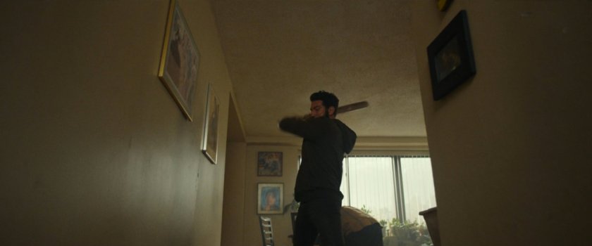 Frank fighting would-be killers in Isaiah's apartment.