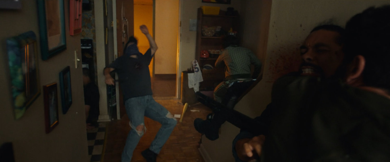 Frank fighting would-be killers in Isaiah's apartment.
