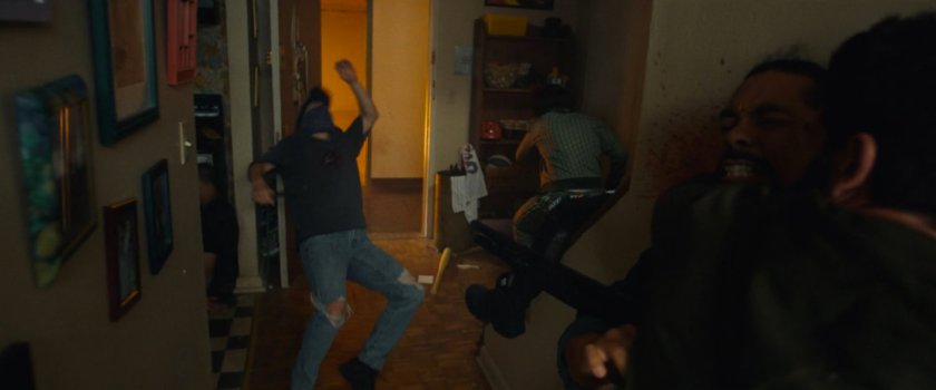 Frank fighting would-be killers in Isaiah's apartment.