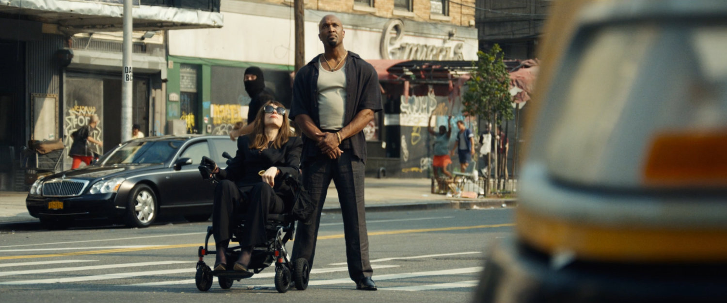 Ma Gnucci and Barry watch the criminals attacking Frank from the street below his building.