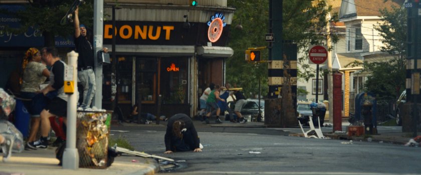 Rioters beating up Dre outside his Donut Shop in Little Sicily.