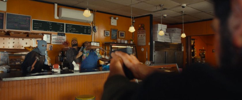 Rioters hold Debbie hostage in Dre's Donut Shop.