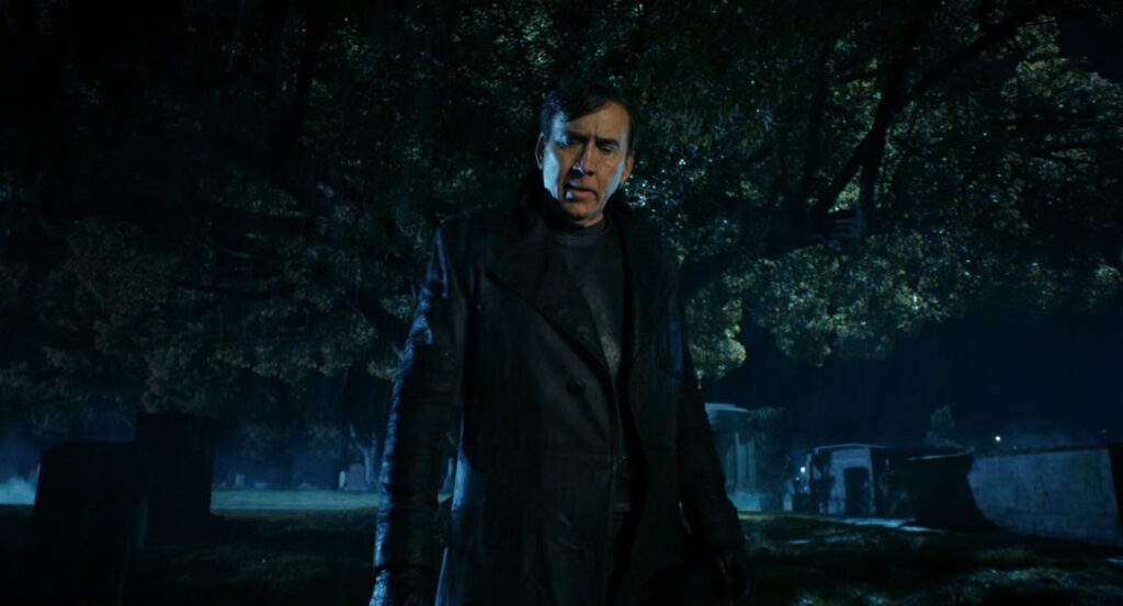 Ben at a cemetery at night.