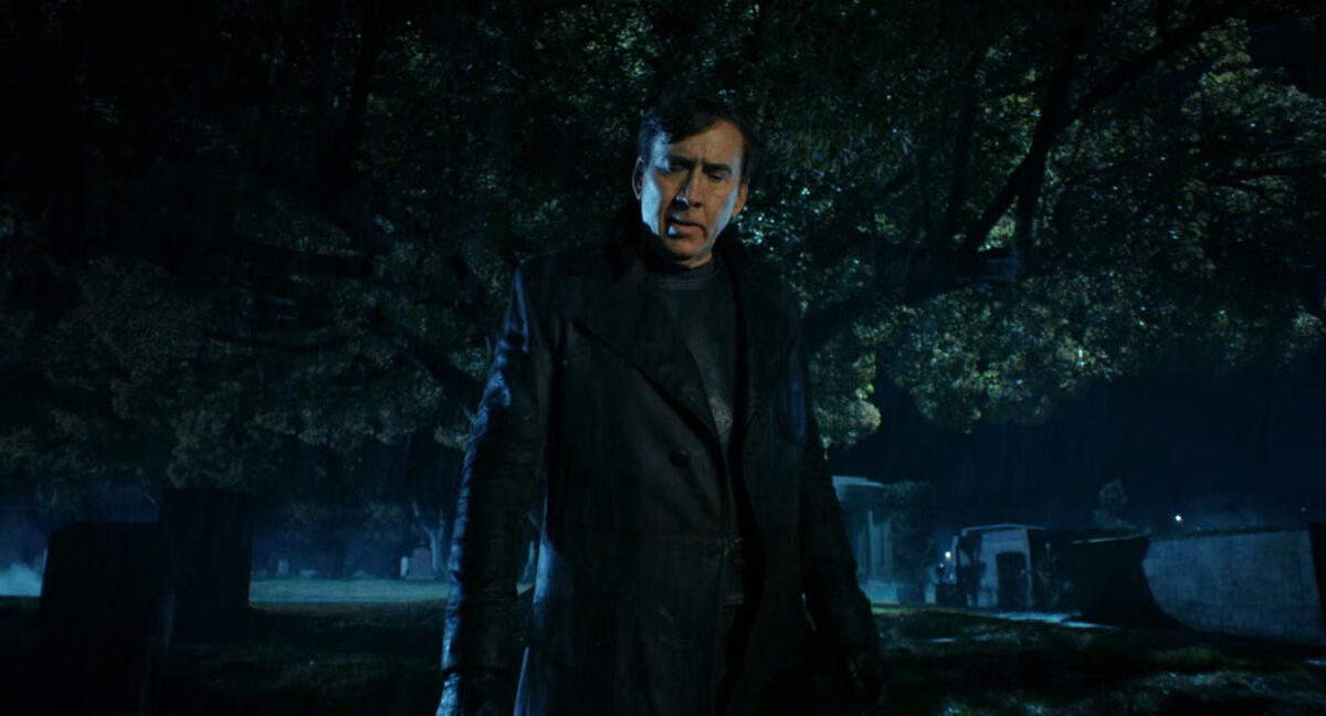 Ben at a cemetery at night.