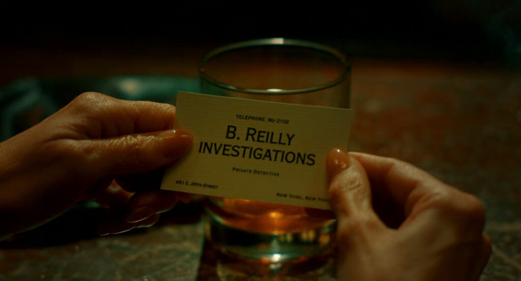 Close-up of Ben Reilly's business card.