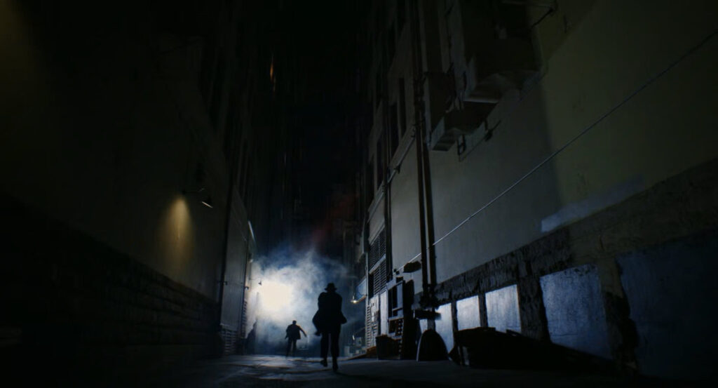Ben chasing Addison through a dark alley.