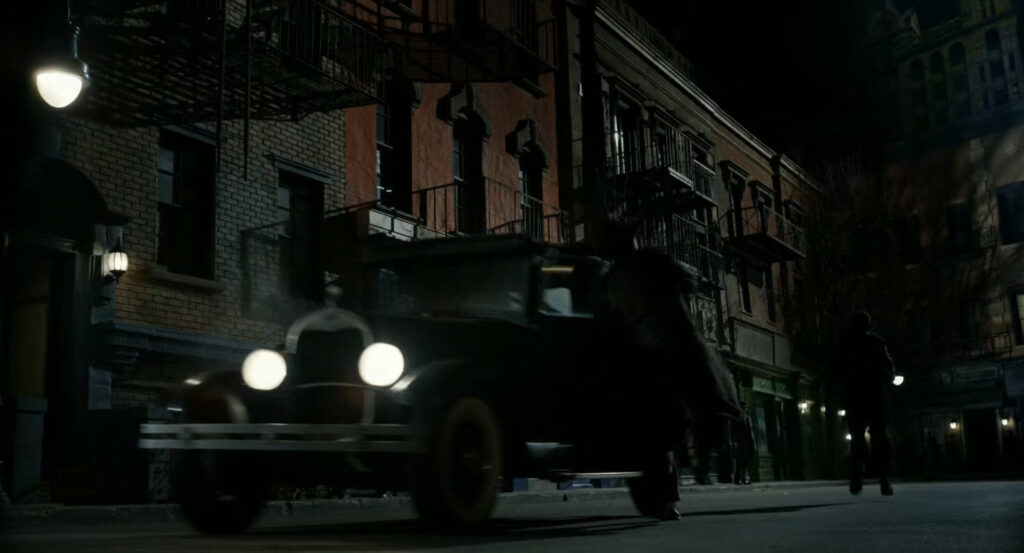 Ben chasing Addison and getting hit by a car along a dark street.